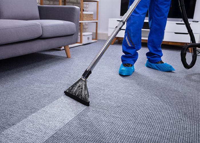 Carpet cleaning technician working in a Summit County, CO living room